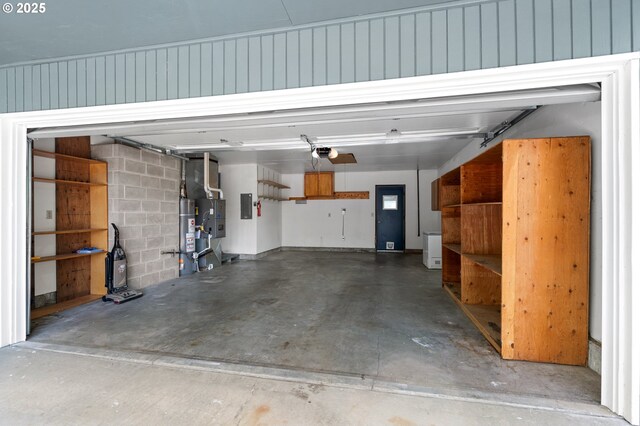 1911 SW Vista Pl, Pendleton, OR 97801 - garage with electric panel, a garage door opener, and concrete block wall