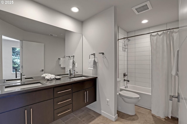 full bath featuring toilet, double vanity, shower / bath combination with curtain, baseboards, and tile patterned floors
