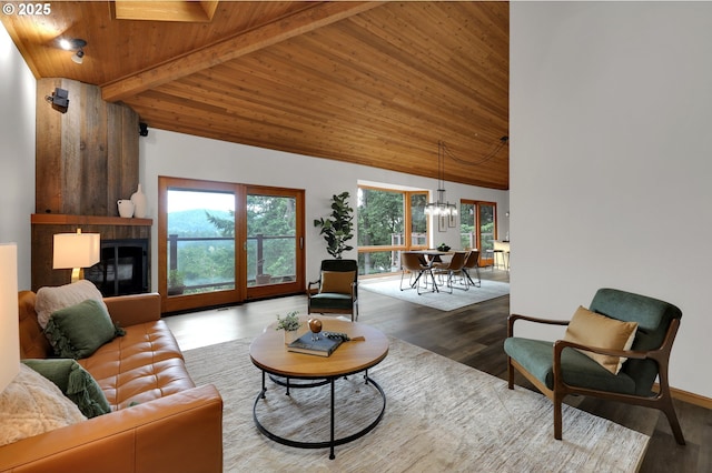 3758 Pine Canyon Dr, Eugene, OR 97405 - living area with wooden ceiling, a chandelier, wood finished floors, and a tile fireplace