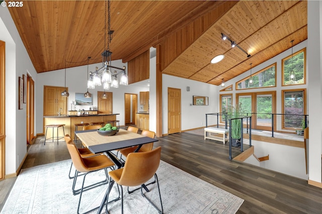 3758 Pine Canyon Dr, Eugene, OR 97405 - dining space with wooden ceiling, high vaulted ceiling, baseboards, wood finished floors, and a chandelier