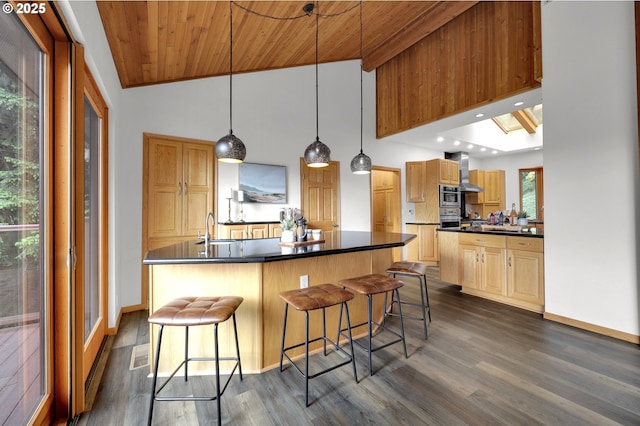 3758 Pine Canyon Dr, Eugene, OR 97405 - kitchen featuring dark countertops, stainless steel oven, dark wood-style flooring, wood ceiling, and a sink