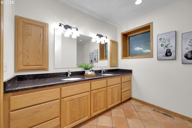 3758 Pine Canyon Dr, Eugene, OR 97405 - bathroom featuring double vanity, tile patterned floors, and baseboards