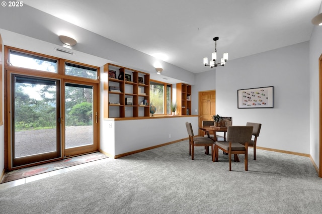 3758 Pine Canyon Dr, Eugene, OR 97405 - carpeted dining area featuring a chandelier and baseboards