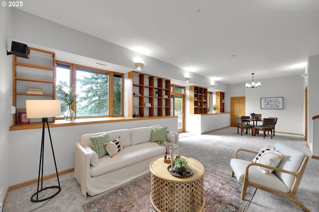 3758 Pine Canyon Dr, Eugene, OR 97405 - living room featuring carpet, baseboards, and a chandelier