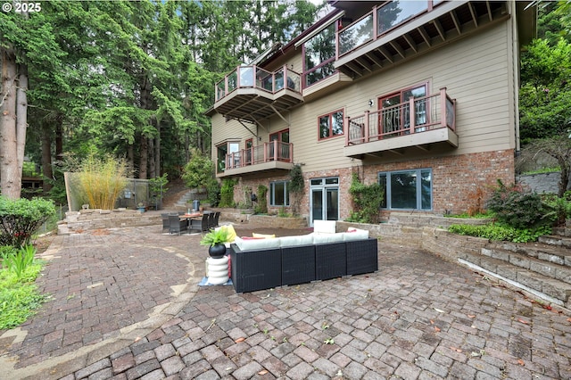 3758 Pine Canyon Dr, Eugene, OR 97405 - view of patio / terrace with a balcony and an outdoor living space