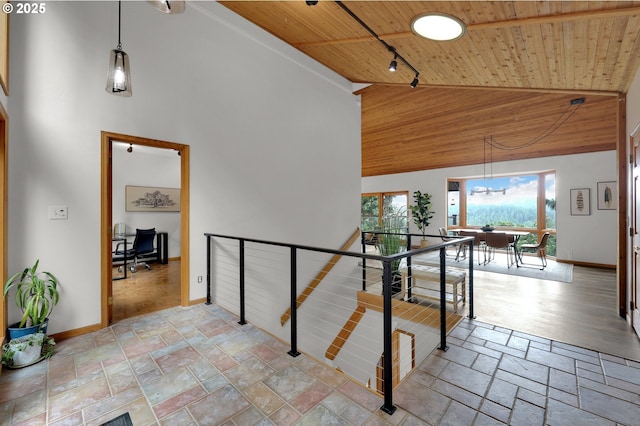 3758 Pine Canyon Dr, Eugene, OR 97405 - staircase with wooden ceiling, high vaulted ceiling, stone tile flooring, baseboards, and track lighting