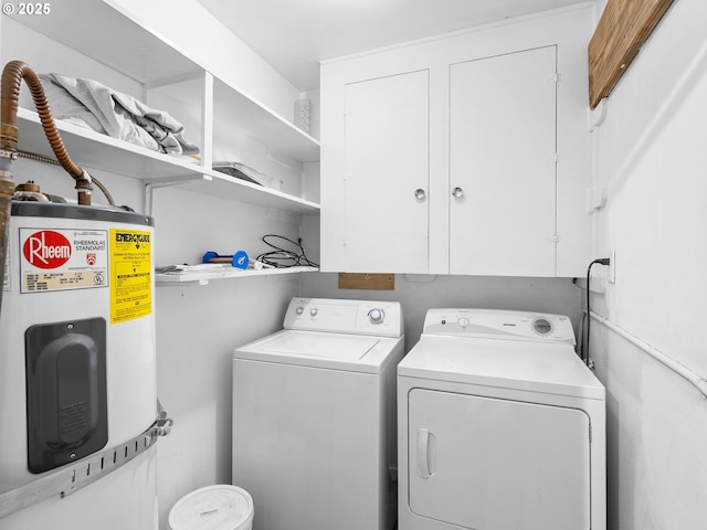 3516 N Missouri Ave, Portland, OR 97227 - laundry area featuring electric water heater, washing machine and dryer, and cabinet space
