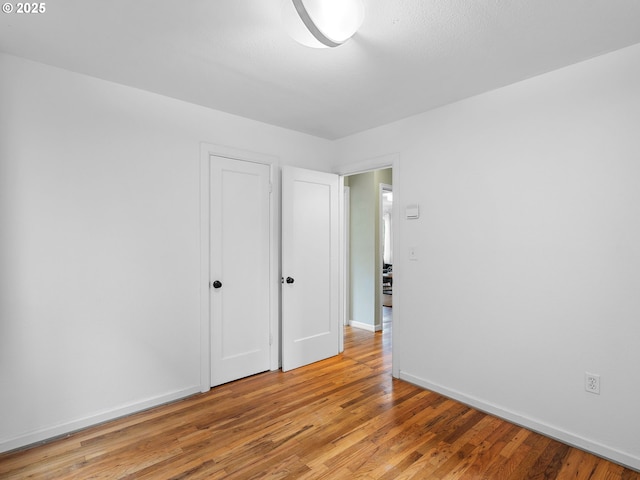 3516 N Missouri Ave, Portland, OR 97227 - unfurnished bedroom with light wood-style floors and baseboards