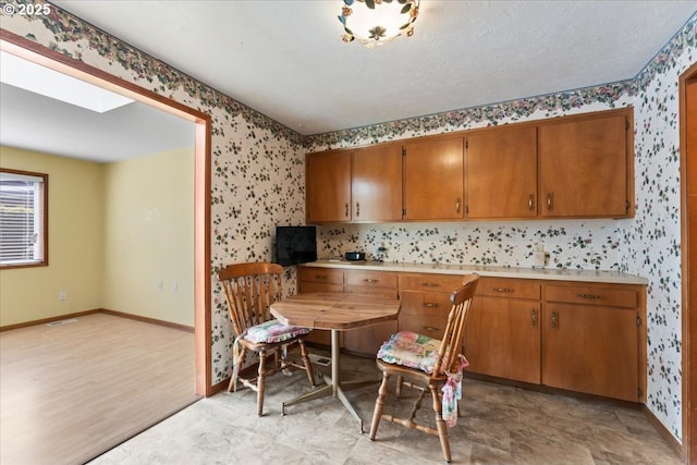 2242 W Hayes St, Woodburn, OR 97071 - dining room with wallpapered walls and baseboards