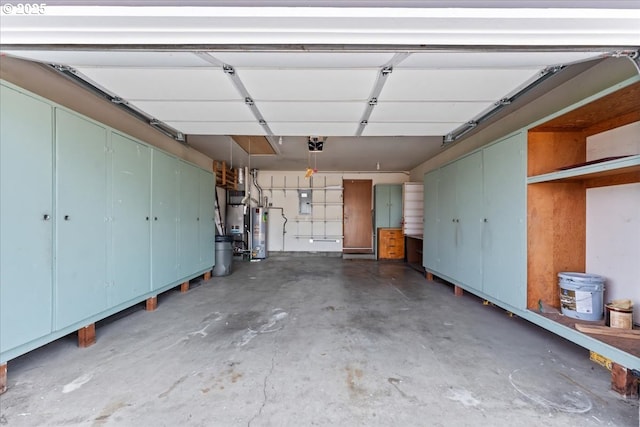 2242 W Hayes St, Woodburn, OR 97071 - garage featuring a garage door opener, gas water heater, and electric panel