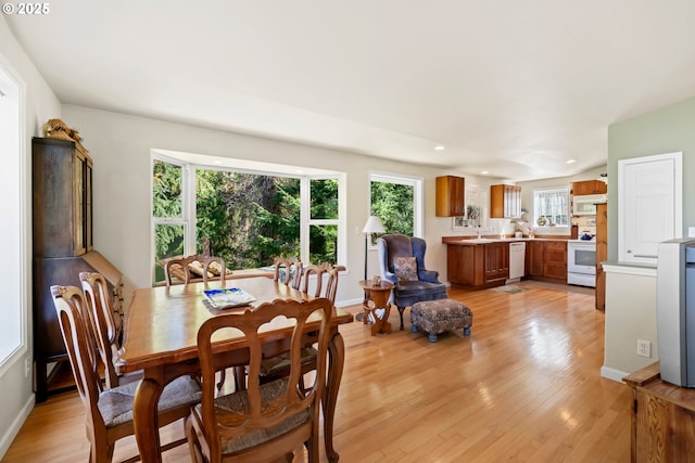 9320 Nehalem Rd, Manzanita, OR 97130 - dining room featuring light wood-style floors, baseboards, and recessed lighting