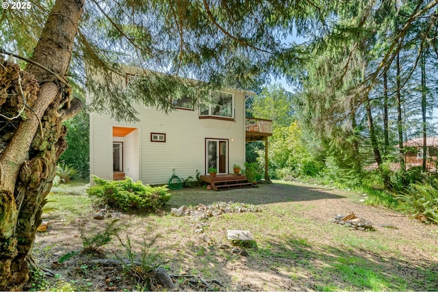 back of house featuring a deck