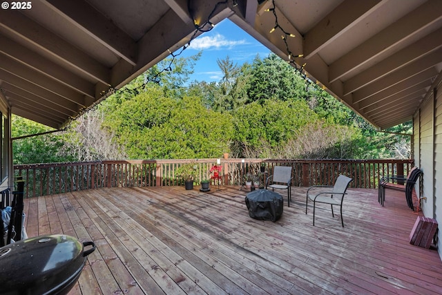 wooden deck with grilling area