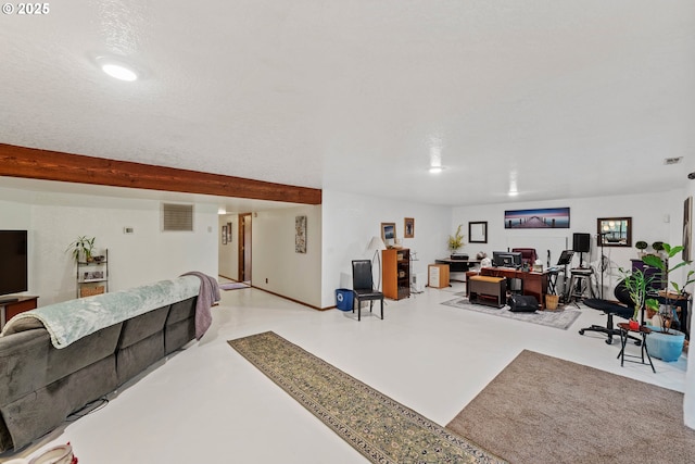 interior space with concrete flooring, visible vents, beamed ceiling, and a textured ceiling