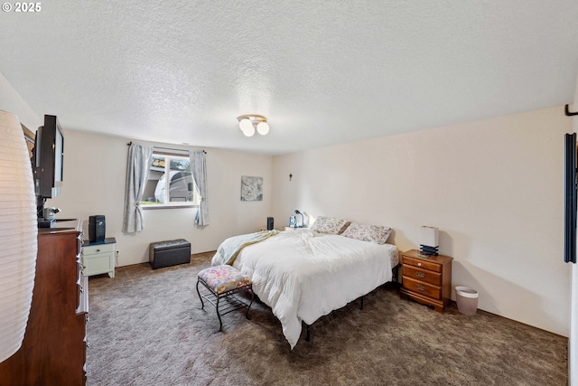 bedroom featuring a textured ceiling and carpet