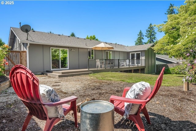 11595 SW Fairview Ln, Tigard, OR 97223 - back of house featuring board and batten siding, a shingled roof, and french doors