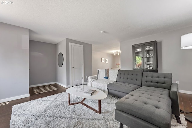11595 SW Fairview Ln, Tigard, OR 97223 - living area featuring baseboards, wood finished floors, and a textured ceiling
