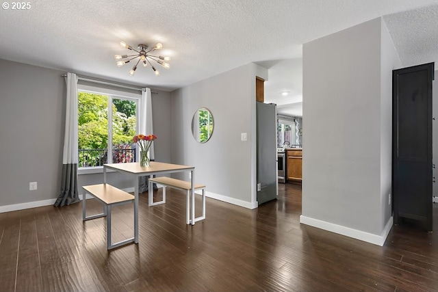 11595 SW Fairview Ln, Tigard, OR 97223 - dining area featuring a chandelier, baseboards, a textured ceiling, and dark wood finished floors