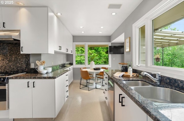 3132 SW Altadena Ter, Portland, OR 97239 - kitchen with range hood, a sink, tasteful backsplash, white cabinets, and recessed lighting