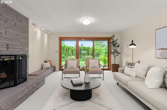 3132 SW Altadena Ter, Portland, OR 97239 - living area featuring a stone fireplace and carpet flooring