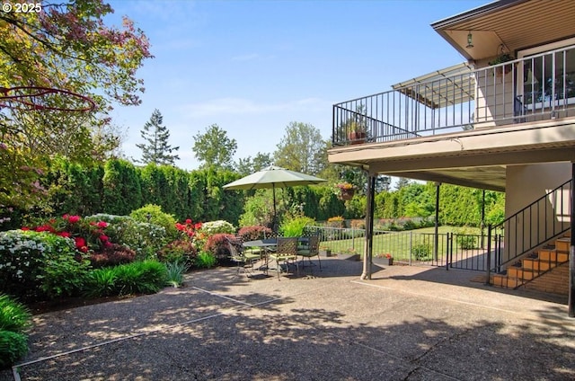3132 SW Altadena Ter, Portland, OR 97239 - view of yard with stairway, a balcony, and a patio