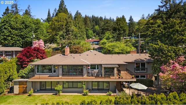 3132 SW Altadena Ter, Portland, OR 97239 - back of house featuring a chimney, a wooden deck, and stairway
