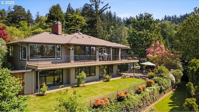3132 SW Altadena Ter, Portland, OR 97239 - back of house with a chimney, a shingled roof, and a deck