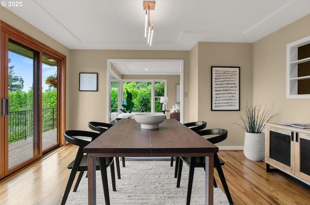 3132 SW Altadena Ter, Portland, OR 97239 - dining room featuring light wood finished floors, healthy amount of natural light, and baseboards