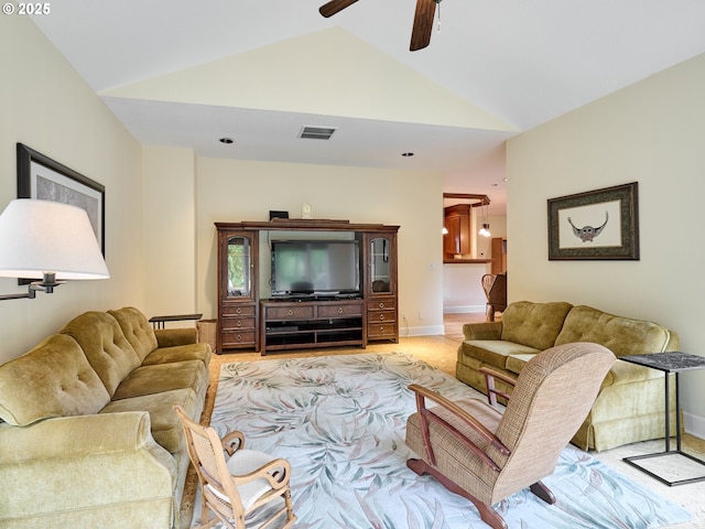 living room featuring light carpet, vaulted ceiling, and ceiling fan