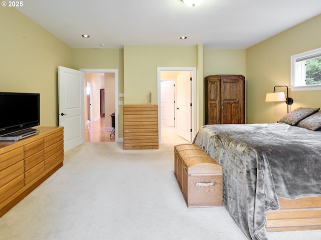 bedroom featuring light carpet