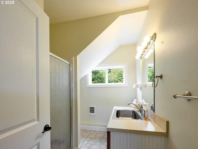 bathroom with vanity and walk in shower