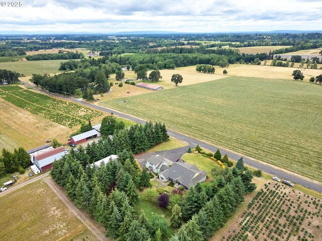 birds eye view of property featuring a rural view