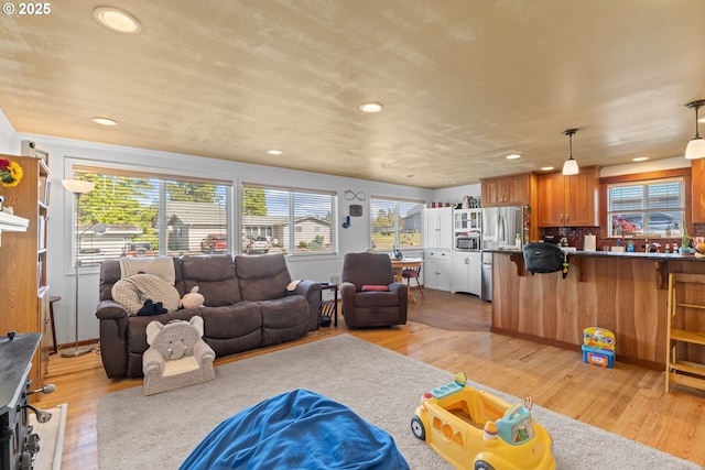 1910 Lincoln St, North Bend, OR 97459 - living room with healthy amount of natural light, light wood-style flooring, and recessed lighting