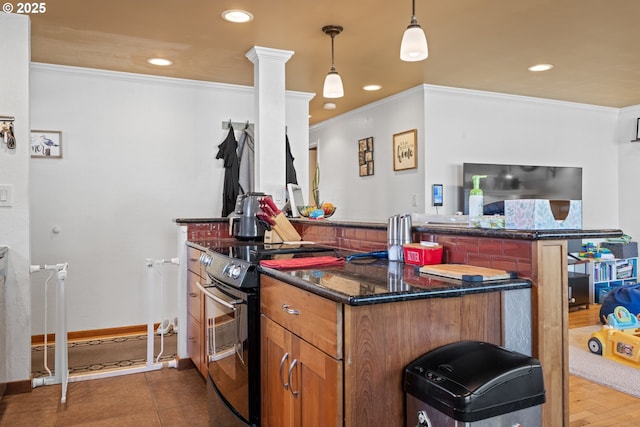 1910 Lincoln St, North Bend, OR 97459 - kitchen with electric stove, recessed lighting, a peninsula, ornamental molding, and dark stone counters