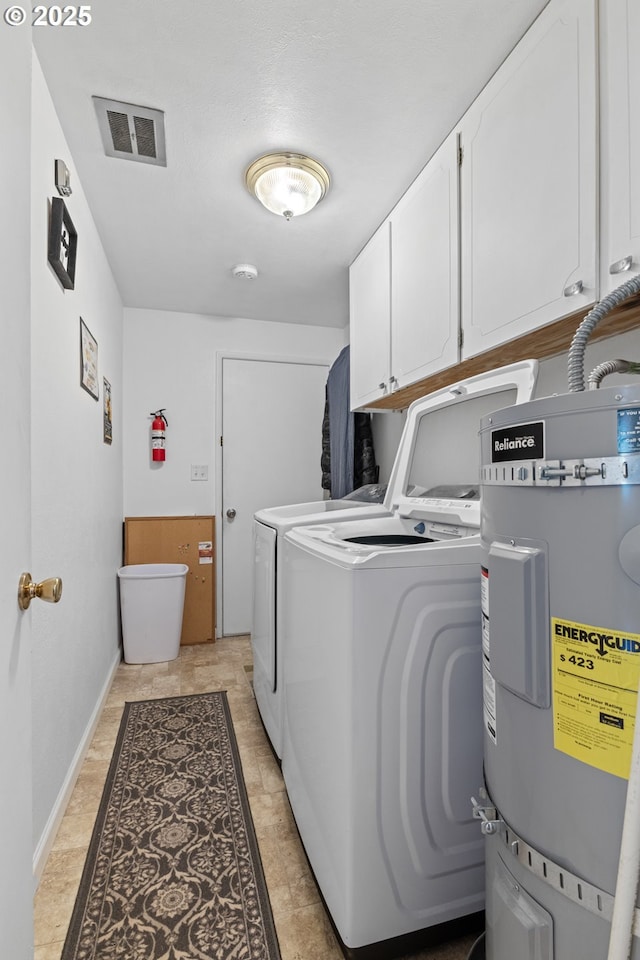 1910 Lincoln St, North Bend, OR 97459 - laundry area featuring cabinet space, strapped water heater, and washing machine and clothes dryer