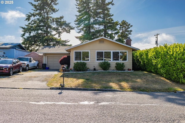 1910 Lincoln St, North Bend, OR 97459 - ranch-style house with a garage, driveway, a chimney, and a front yard