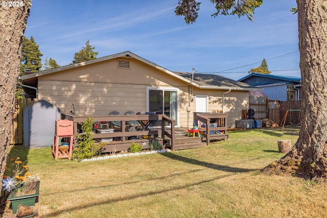 1910 Lincoln St, North Bend, OR 97459 - back of property featuring a deck and a storage unit