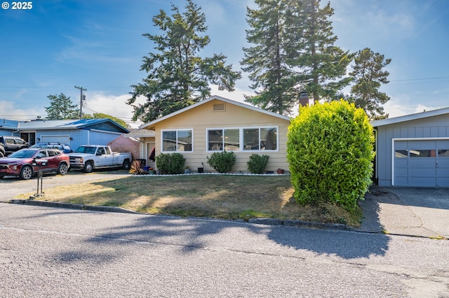1910 Lincoln St, North Bend, OR 97459 - view of front of property featuring driveway, a front yard, and a garage