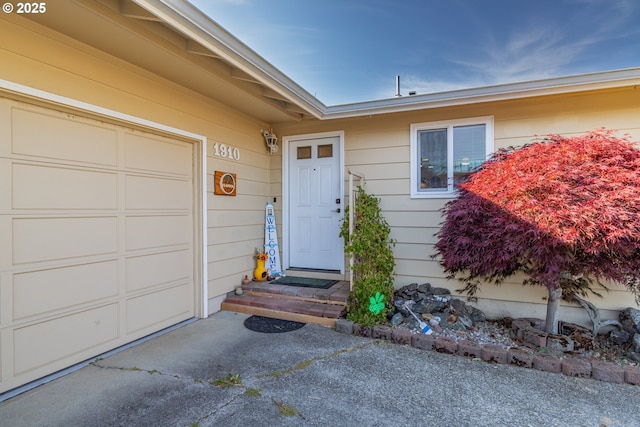 1910 Lincoln St, North Bend, OR 97459 - doorway to property featuring a garage and driveway