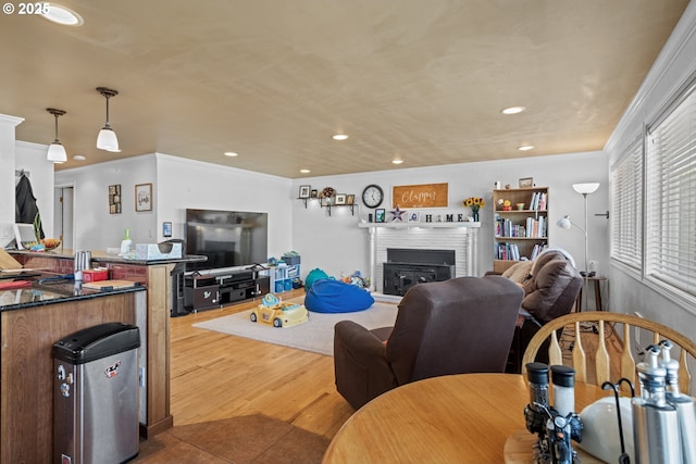 1910 Lincoln St, North Bend, OR 97459 - living room with a fireplace, ornamental molding, recessed lighting, and wood finished floors