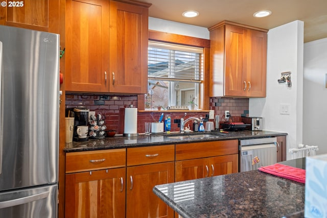1910 Lincoln St, North Bend, OR 97459 - kitchen featuring stainless steel appliances, tasteful backsplash, brown cabinets, and recessed lighting