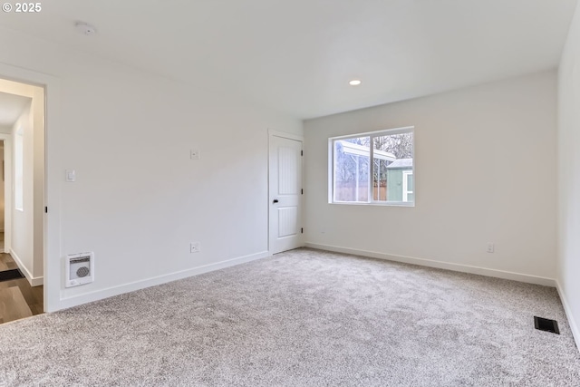 empty room featuring carpet floors