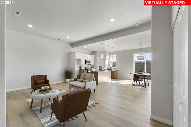 1203 NE Emerald Dr, Hermiston, OR 97838 - living area featuring light wood-style flooring and recessed lighting