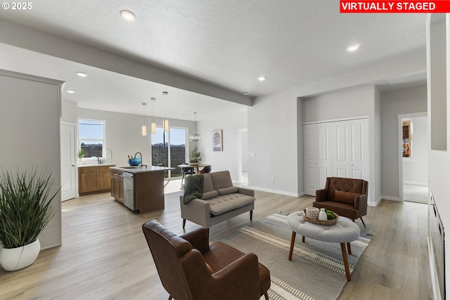 1203 NE Emerald Dr, Hermiston, OR 97838 - living room featuring light wood-type flooring and recessed lighting