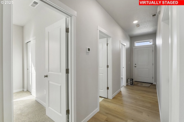 1203 NE Emerald Dr, Hermiston, OR 97838 - corridor featuring baseboards and light wood-type flooring