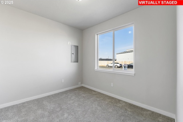 1203 NE Emerald Dr, Hermiston, OR 97838 - spare room featuring electric panel and carpet flooring
