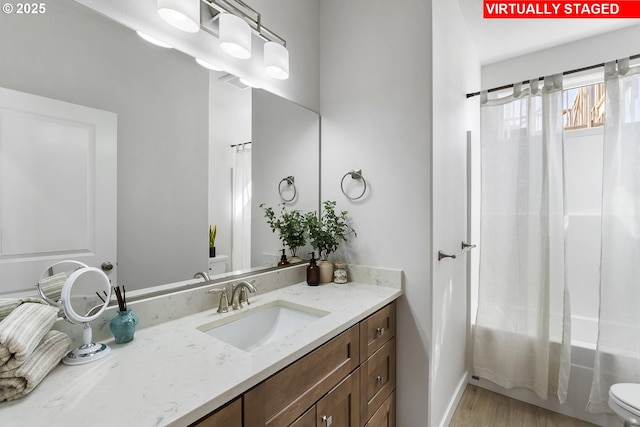 1203 NE Emerald Dr, Hermiston, OR 97838 - bathroom featuring vanity, shower / tub combo with curtain, and wood finished floors