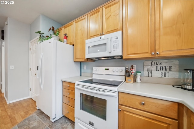 kitchen featuring white appliances and light countertops