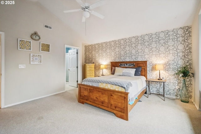 carpeted bedroom with wallpapered walls, baseboards, visible vents, a ceiling fan, and high vaulted ceiling