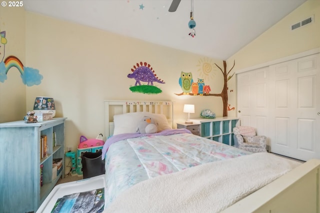 bedroom featuring ceiling fan, visible vents, vaulted ceiling, and a closet